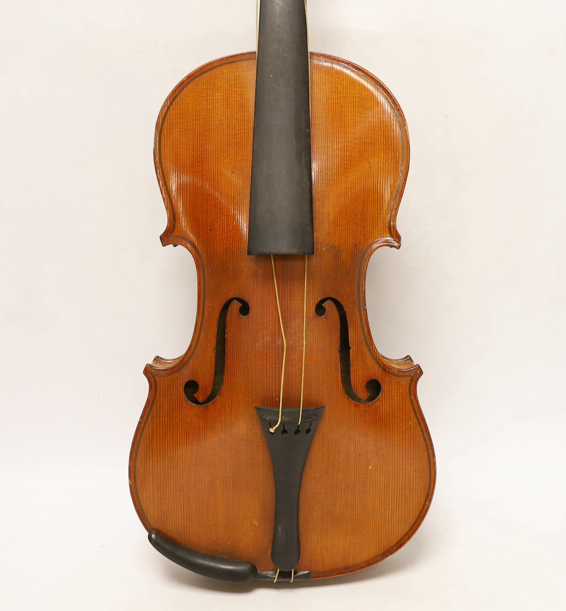 An early 20th century cased violin, length of the back 36cm